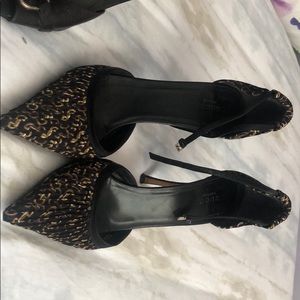 Three pairs of Gucci shoes.